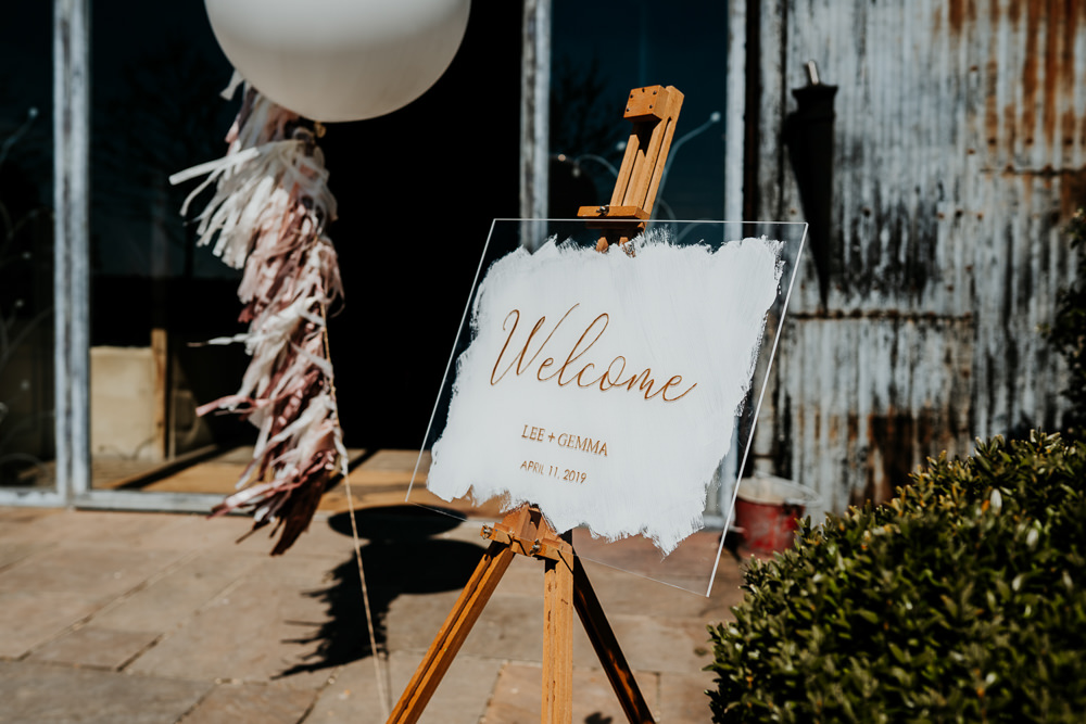 Welcome Sign Glass Easel Giant Balloon Tassel Calligraphy Contemporary Barn Wedding Ryan Goold Photography
