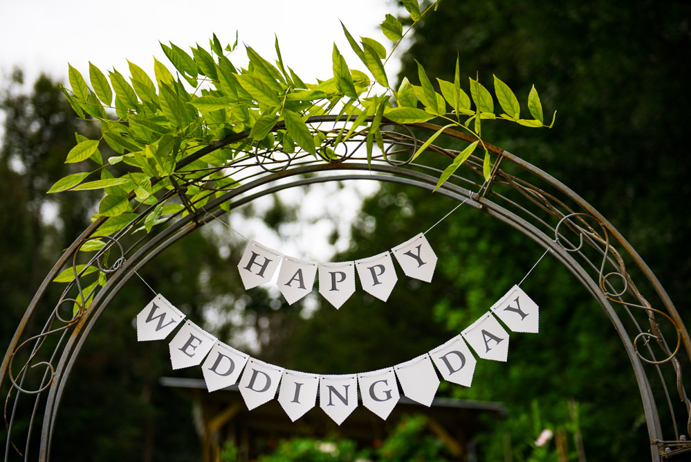 Metal Arch Sign Banner Bunting Cotswolds Garden Wedding Jonny Barratt Photography