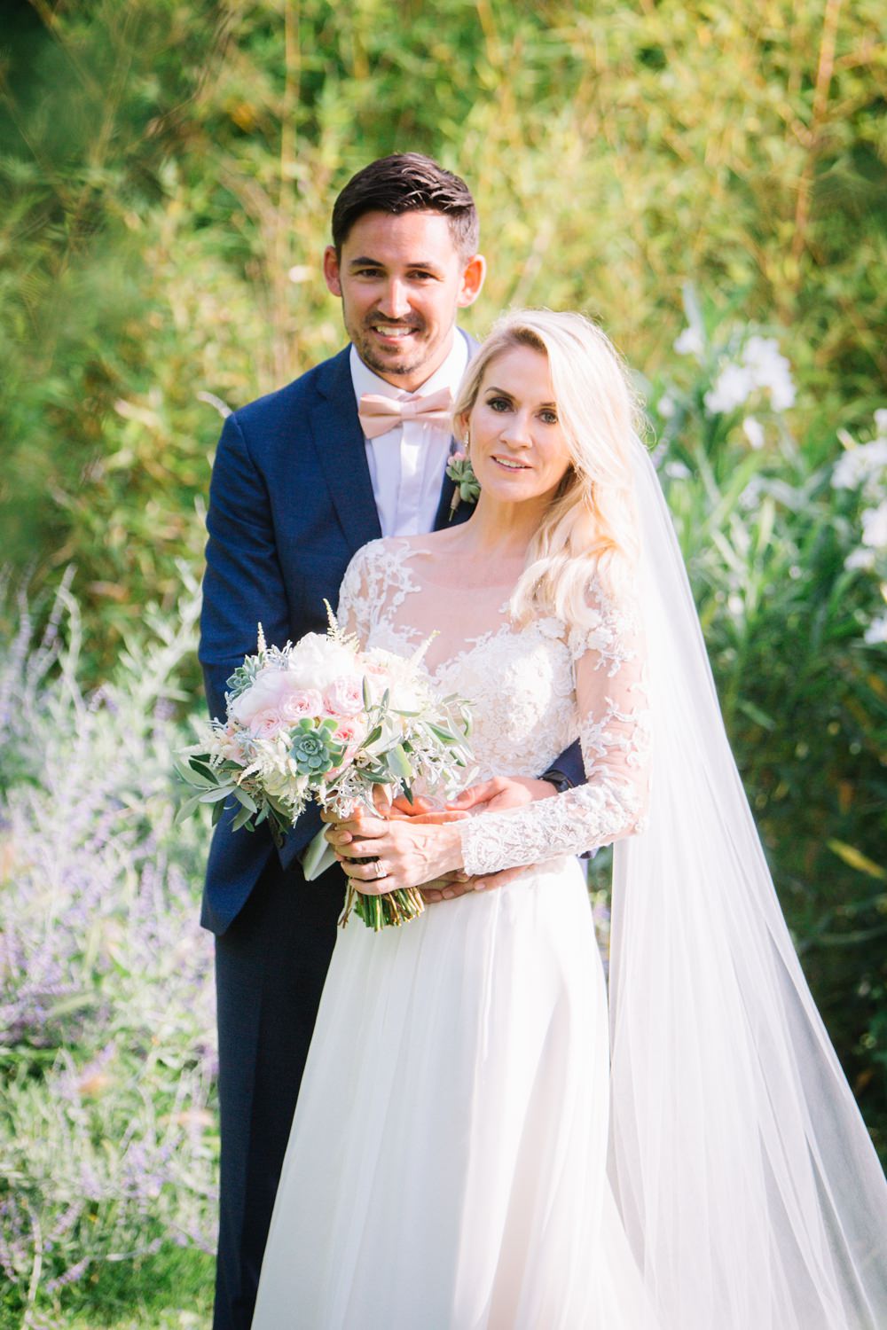 Bride Bridal Long Sleeve Lace Dress Train Navy Blue Suit Groom Pink Bow Tie Bouquet Saint Tropez Wedding Sophie Boulet Photographe