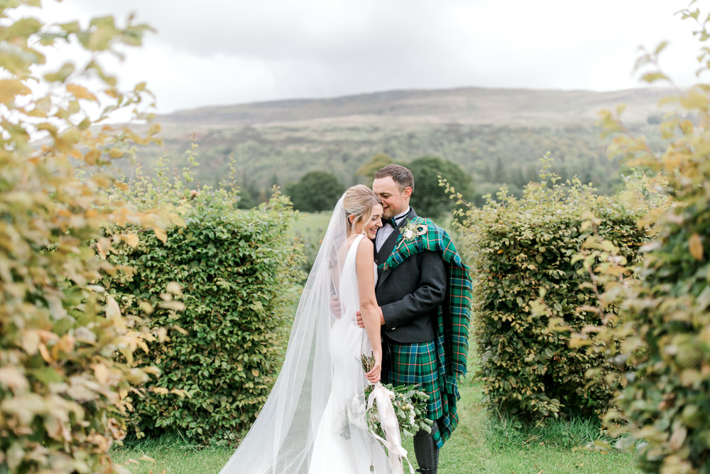 Bride Bridal Deep V Plunge Neckline Dress Sleeveless Slim Fit Ogilvie Tartan Kilt Groom Veil Tin Shed Knockraich Farm Wedding The Gibsons Photography