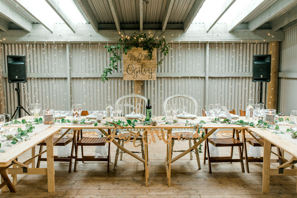 Mr & Mrs Wooden Sign Pea Light Curtain Greenery Tin Shed Knockraich Farm Wedding The Gibsons Photography