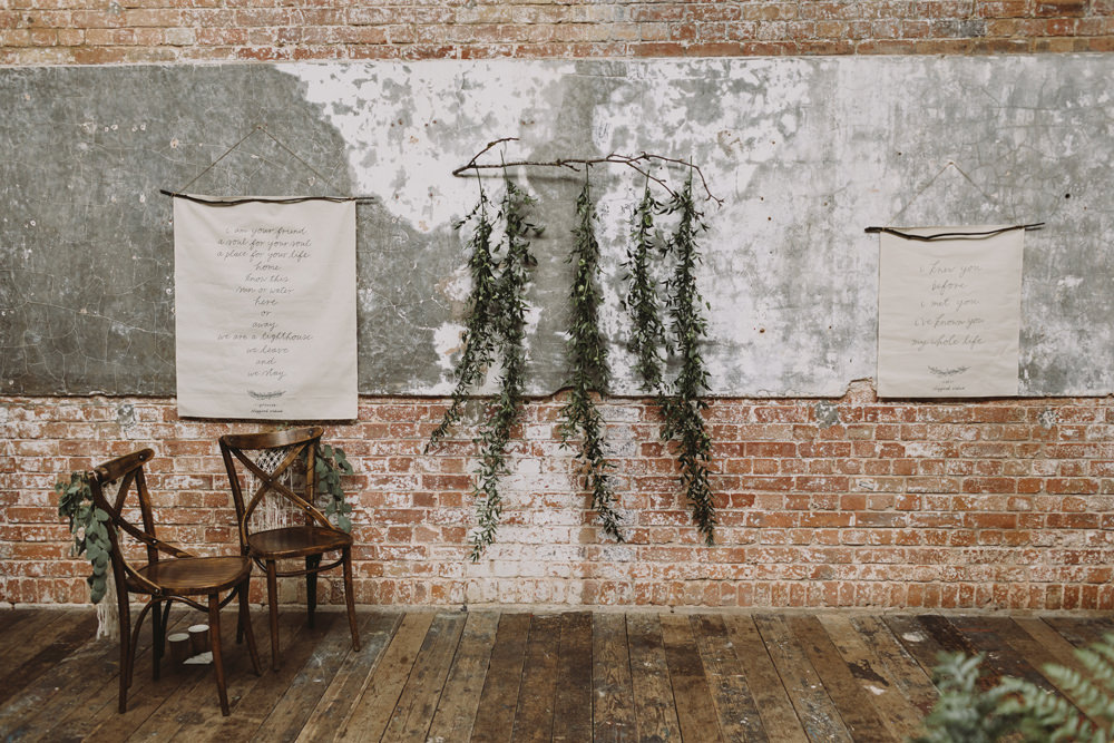 Ceremony Banner Hanging Foliage Greenery Industrial Tram House Wedding Luke Hayden Photography