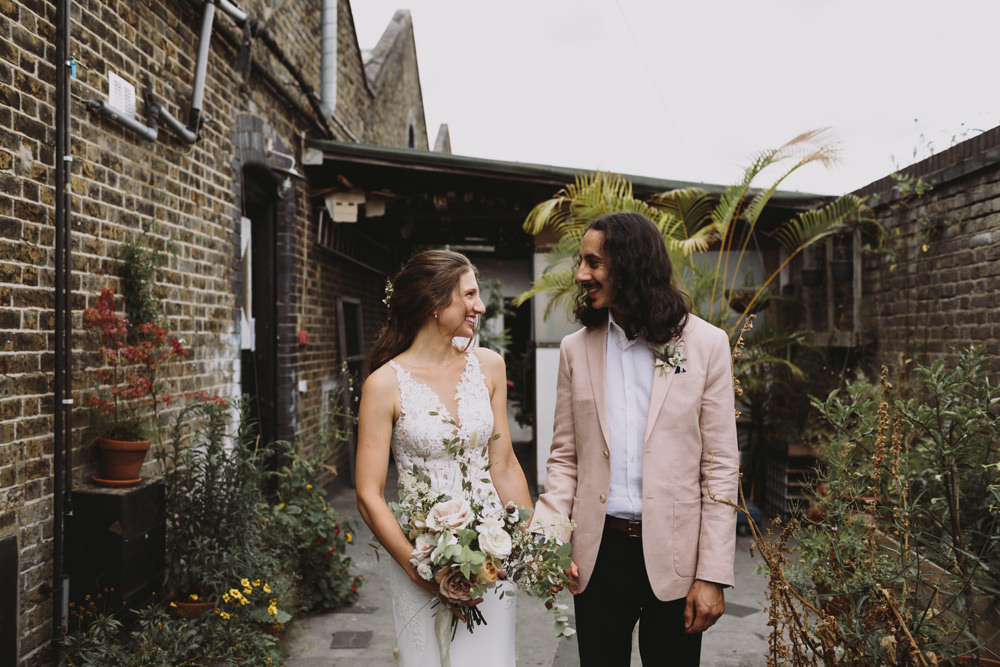Bride Bridal Sleeveless V Neck Fit and Flare Train Pronovias Dress Gown Pink Jacket Reiss Groom Wild Bouquet Loose Handtied Rose Tram House Wedding Luke Hayden Photography