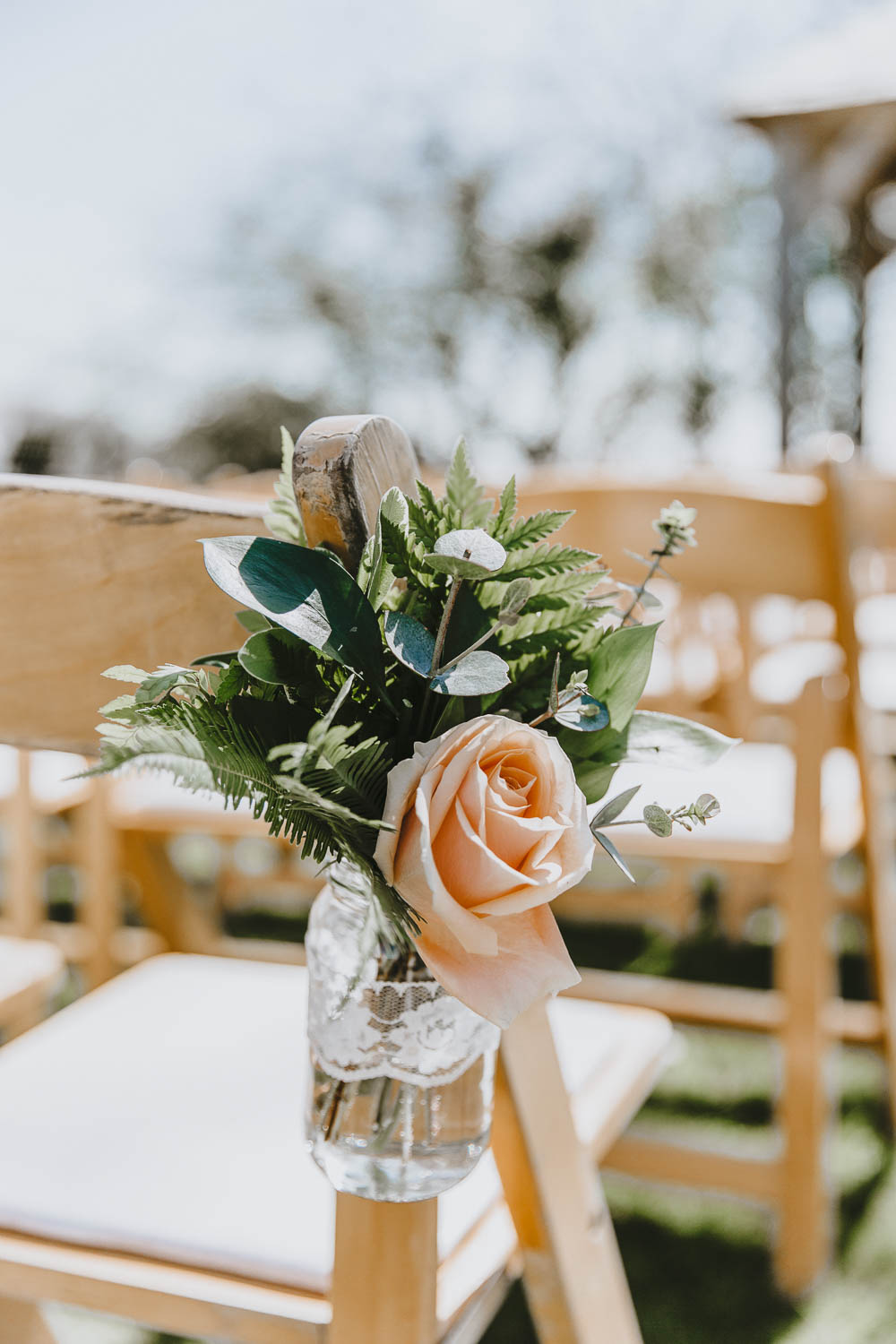 Chair Flowers Pew End Aisle Jar Lace Ribbon Blush Rose Trevenna Barns Wedding Wild Tide Creative