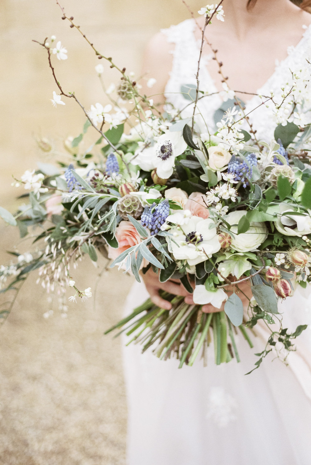 Bouquet Flowers Bride Bridal Grape Hyacinth Anemone Greenery Folliage Nigella Seeds Scabious Blossom Winter Blue Barn Wedding Ideas Joanna Briggs Photography