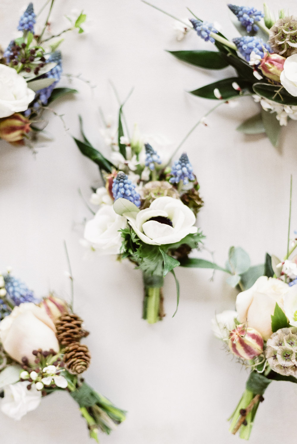 Buttonhole Flowers Grape Hyacinth Anemone Pine Cones Winter Blue Barn Wedding Ideas Joanna Briggs Photography