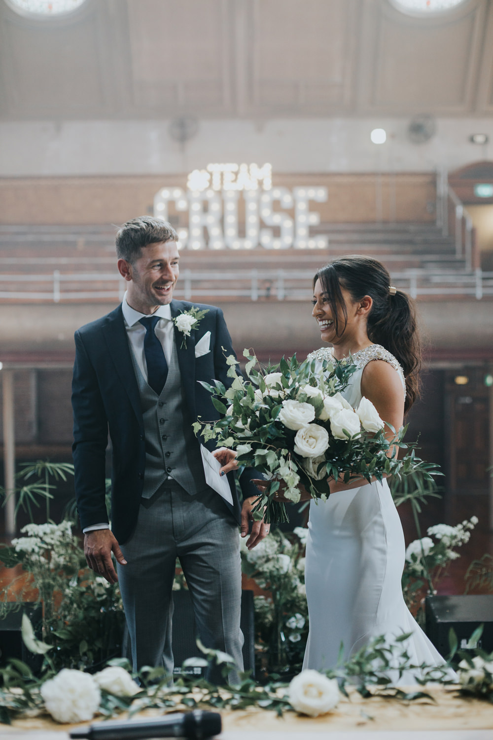 Pronovias Dress Gown Fit and Flare Embellished Sparkle Long Train Mismatched Suit Groom White Flowers Floral Greenery Bouquet Albert Hall Manchester Wedding Katie Dervin Photography