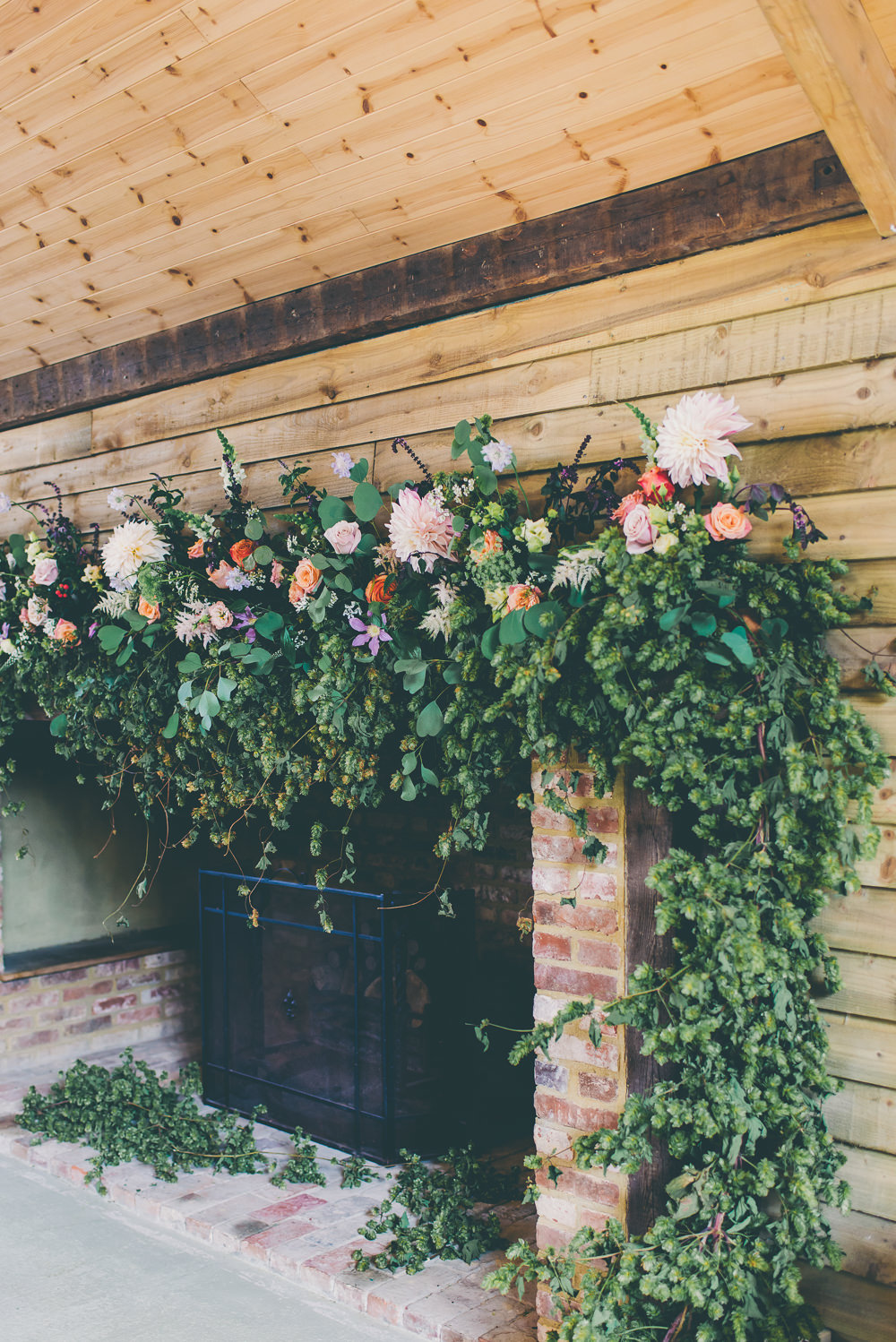 Fireplace Flowers Arrangement Floral Installation Greenery Foliage Peach Dahlia Rose Decor Decoration Backdrop High Billinghurst Farm Wedding Larissa Joice Photography