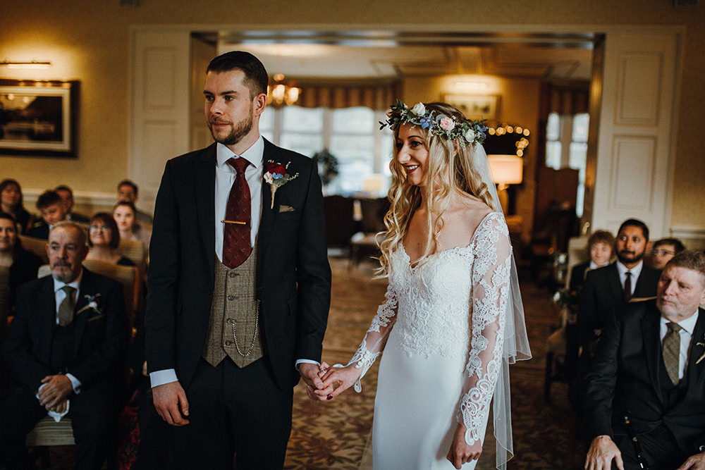 Bride Bridal Sweetheart Neckline Lace Long Sleeve Flower Crown Three Piece Suit Tweed Waistcoat Groom Inn on the Lake Wedding Leah Lombardi Weddings