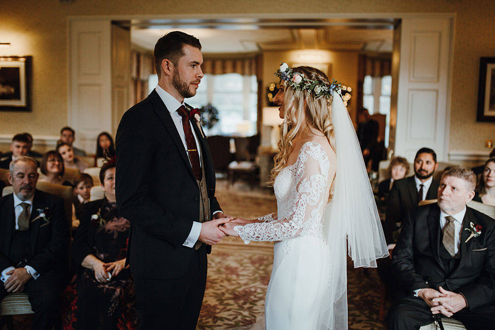 Bride Bridal Sweetheart Neckline Lace Long Sleeve Flower Crown Three Piece Suit Tweed Waistcoat Groom Inn on the Lake Wedding Leah Lombardi Weddings