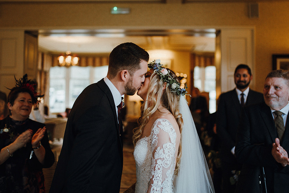 Bride Bridal Sweetheart Neckline Lace Long Sleeve Flower Crown Three Piece Suit Tweed Waistcoat Groom Inn on the Lake Wedding Leah Lombardi Weddings