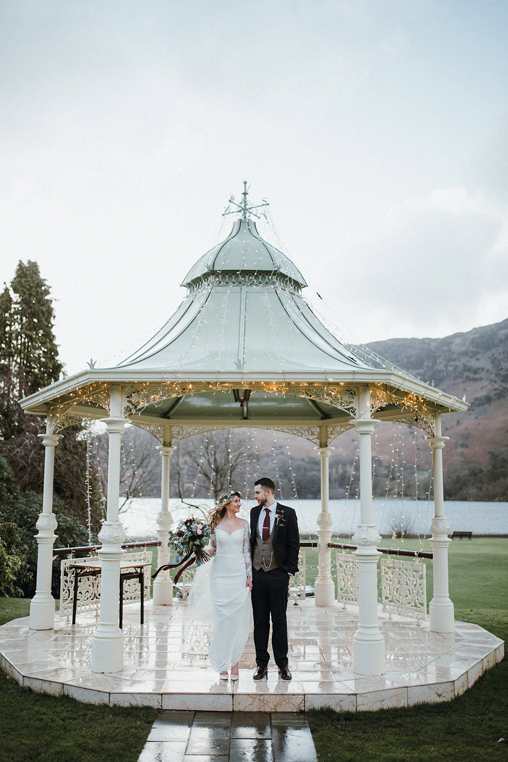 Bride Bridal Sweetheart Neckline Lace Long Sleeve Flower Crown Three Piece Suit Tweed Waistcoat Groom Fairy Light BandstandInn on the Lake Wedding Leah Lombardi Weddings