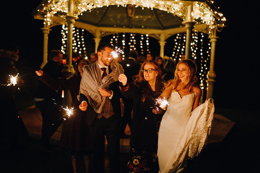 Bride Bridal Sweetheart Neckline Lace Long Sleeve Flower Crown Three Piece Suit Tweed Waistcoat Groom Sparklers Inn on the Lake Wedding Leah Lombardi Weddings