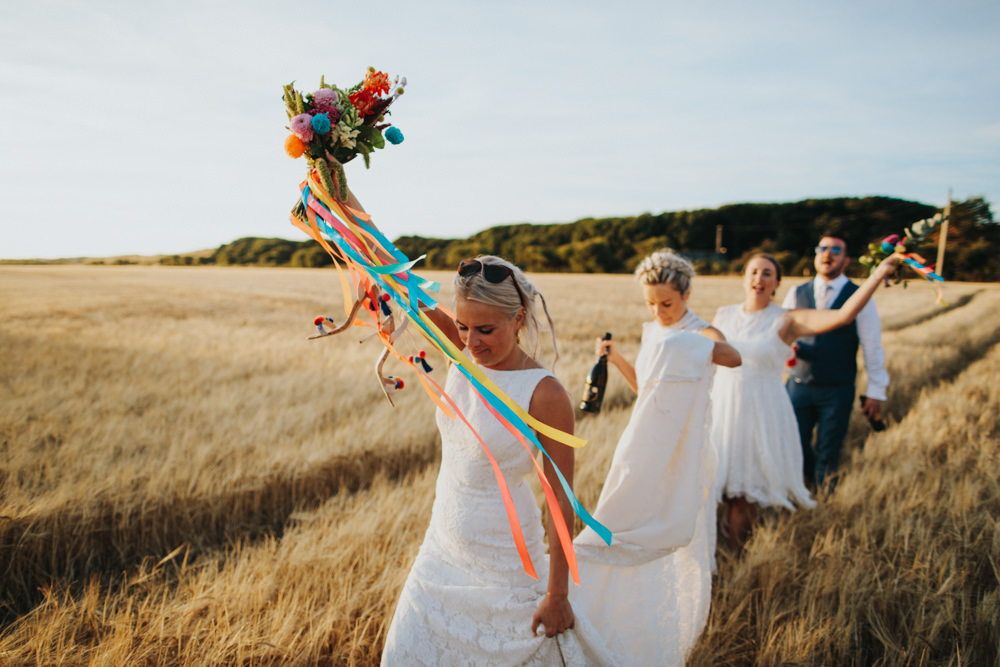 Bride Bridal Pronovias Dress Gown Boat Neck Fitted Ribbon Bouquet Pom Poms Multicoloured Bridesmaids Waxham Great Barn Wedding Joshua Patrick Photography