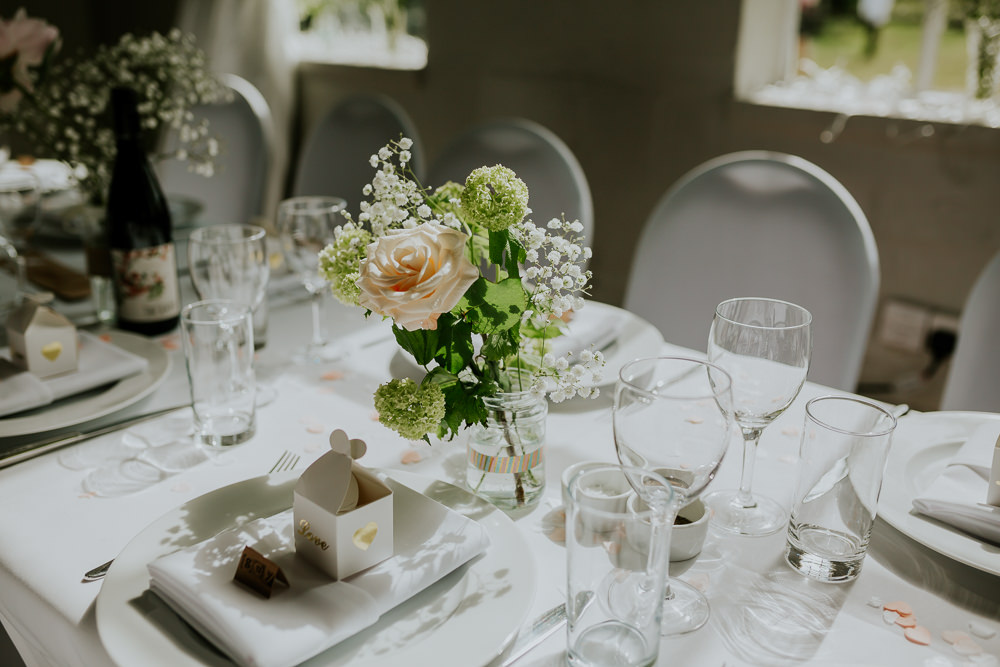 Table Flowers Pretty Centrepiece Decor DIY Village Hall Wedding PhotoBart