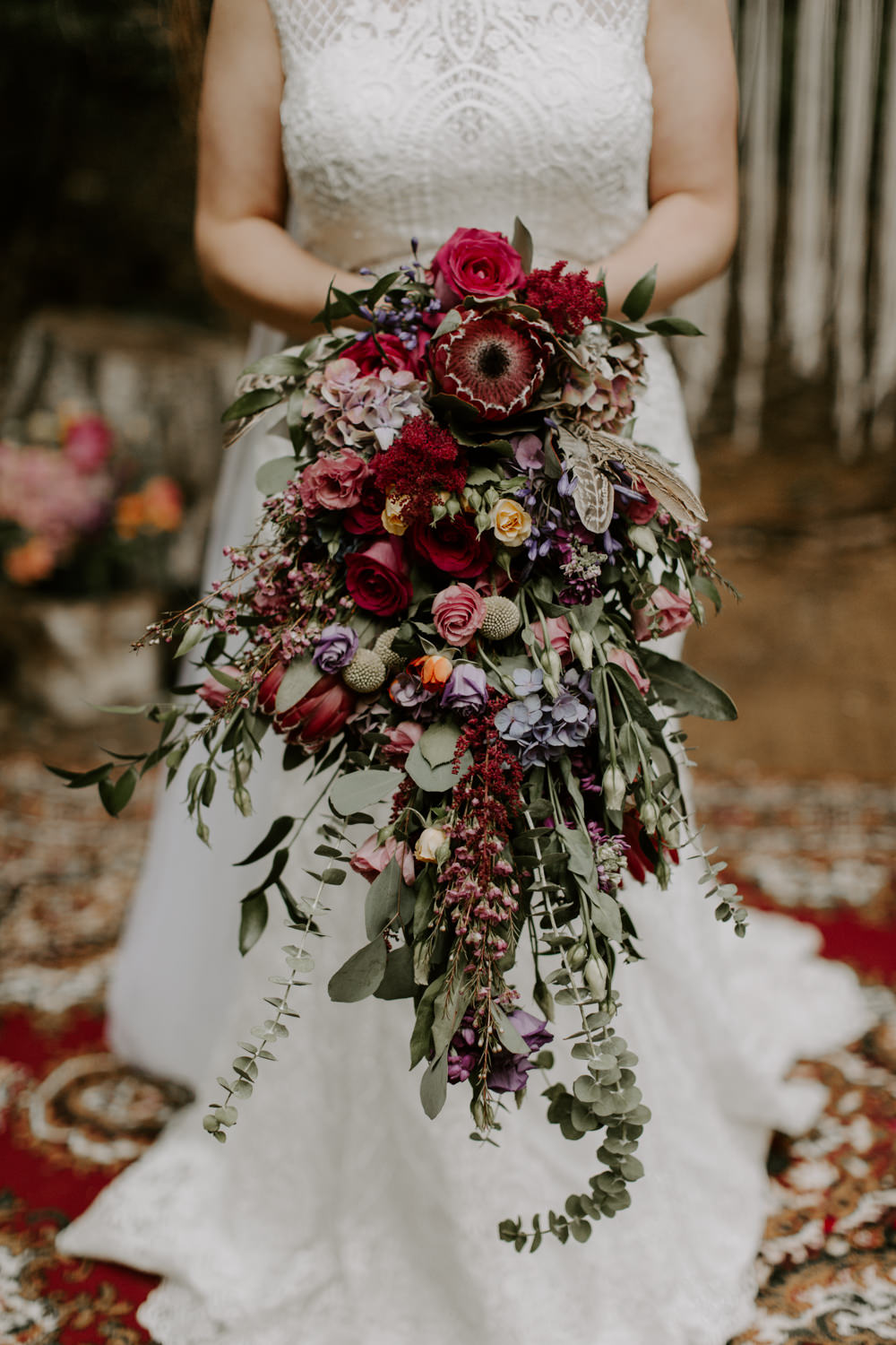Bouquet Flowers Bride Bridal Long Trailing Cascading Protea Rose Red Foliage Greenery Dreys Wedding Grace & Mitch Photo & Film