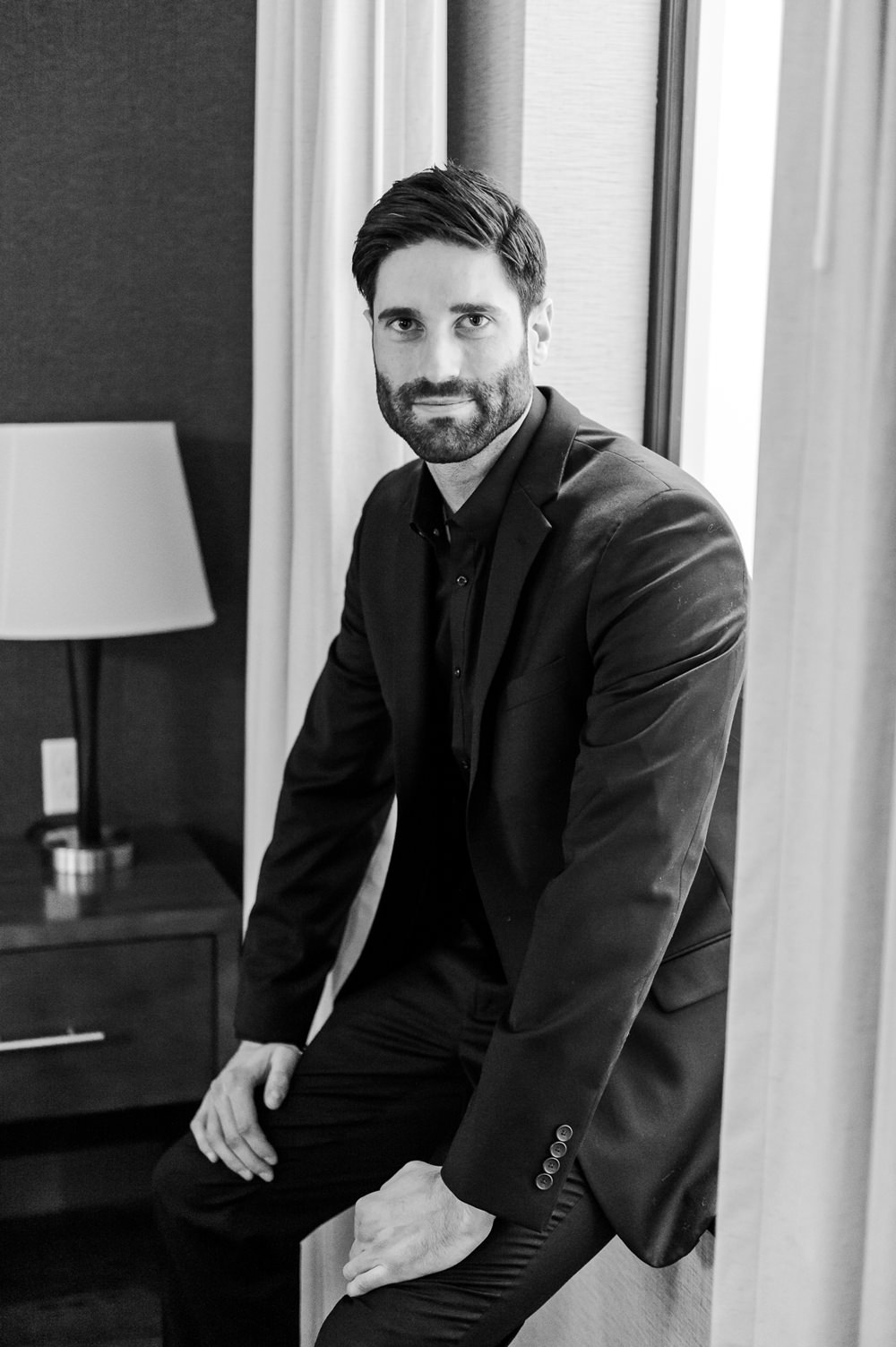 Groom Black Suit Tie Shirt Open Collar Greenhouse Michigan Wedding Jean Smith Photography
