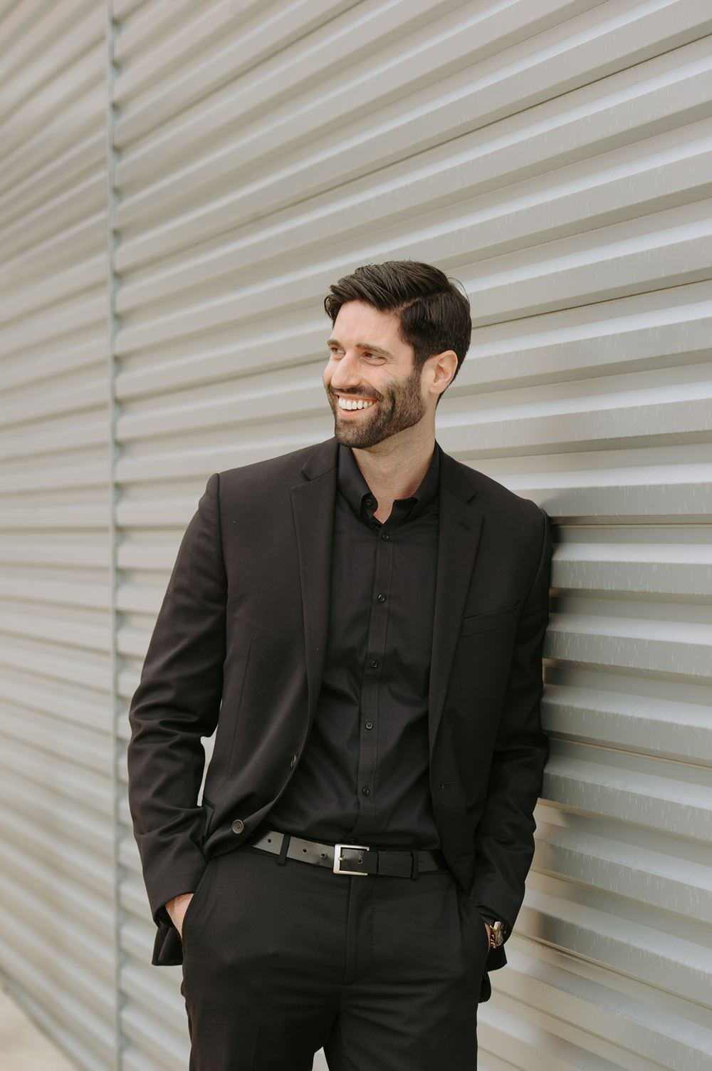 Groom Black Suit Tie Shirt Open Collar Greenhouse Michigan Wedding Jean Smith Photography