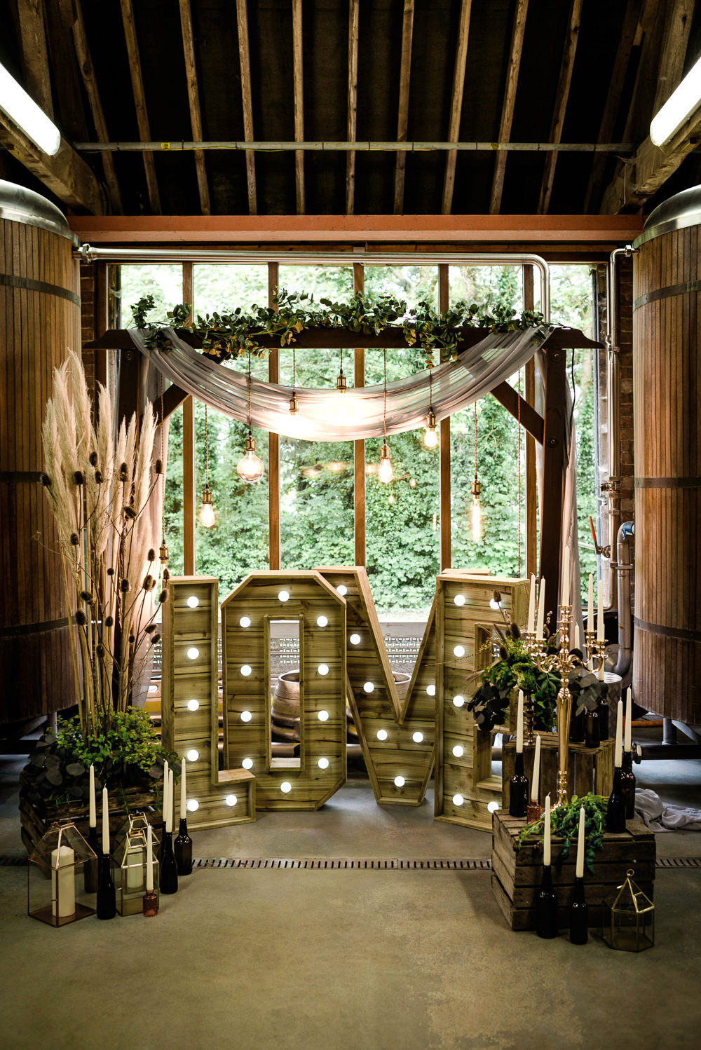 Decor Decoration Backdrop Ceremony Fetoon Lights Edison Lightbulbs Flower Arch Pampas Grass Crates Candles LOVE Letters Indie Wedding Ideas Kat Antos-Lewis Photography
