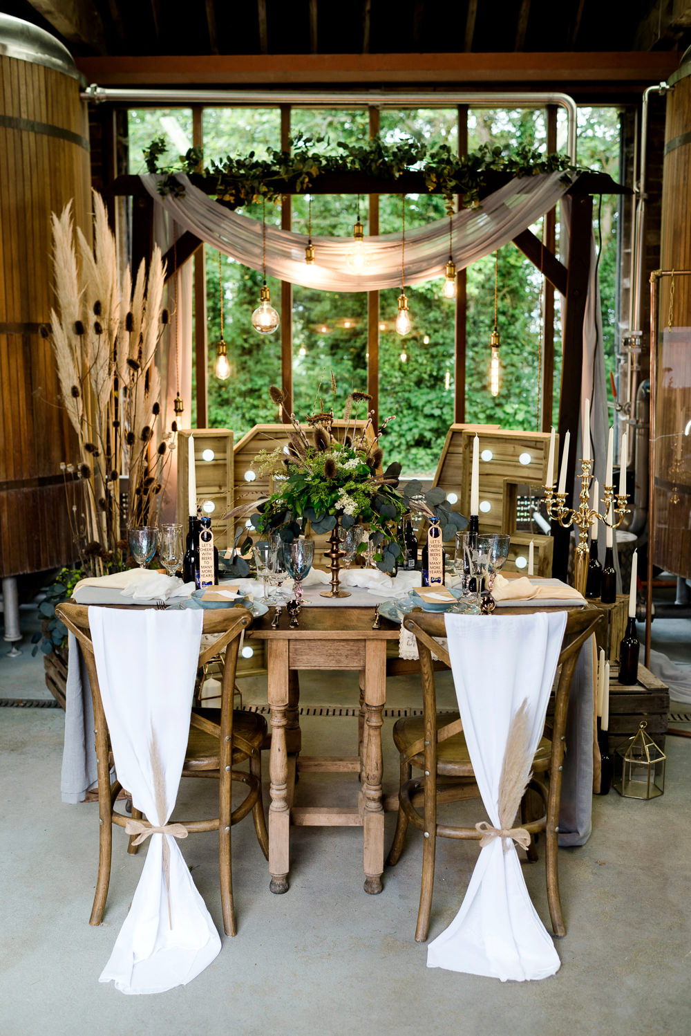 Decor Decoration Backdrop Ceremony Fetoon Lights Edison Lightbulbs Flower Arch Pampas Grass Crates Candles LOVE Letters Table Tablescape Indie Wedding Ideas Kat Antos-Lewis Photography