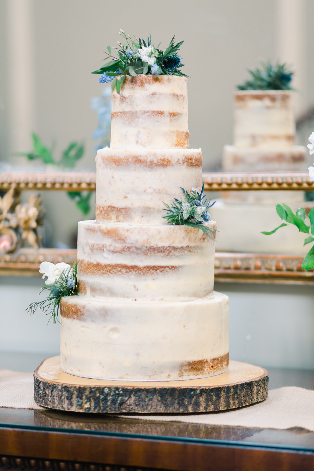 Semi Naked Cake Tall Flowers Log Stand Saltmarshe Hall Wedding Jessica Davies Photography
