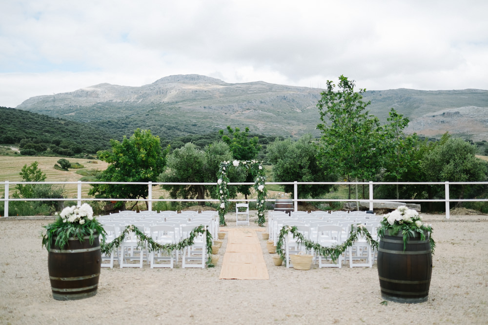 Outdoor Ceremony Aisle Foliage Arch Backdrop Flower Greenery Spain Destination Wedding Jesus Caballero Photography