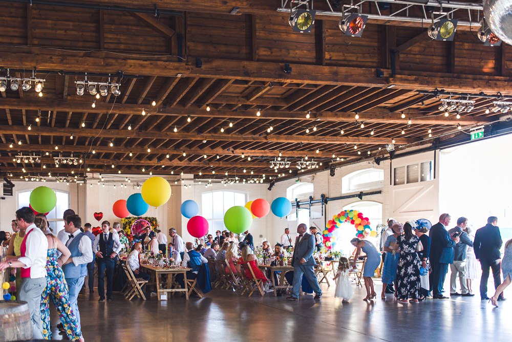 Colourful Multicolour Rainbow Helium Giant Balloons Festoon Lights Trinity Buoy Wharf Wedding Babb Photo