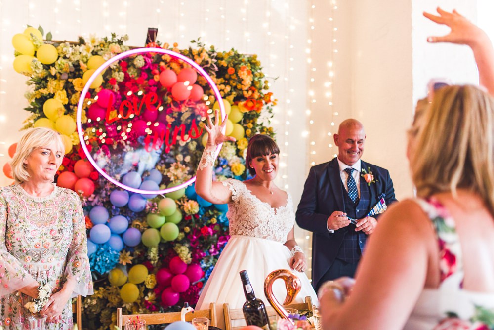 Balloon Wall Backdrop Flowers Multicoloured Rainbow Colourful Neon Sign Decor Decoration Trinity Buoy Wharf Wedding Babb Photo
