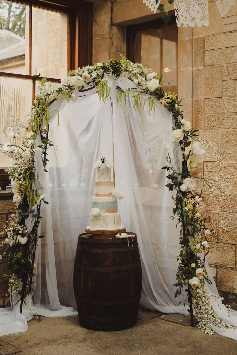 Flower Arch Greenery Foliage Fabric Cake Table Cambo Estate Wedding Anna Urban Wedding Photography