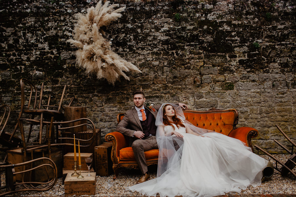 Elopement Wedding Ideas Oilvejoy Photography Crescent Moon Pampas Grass Installation Backdrop Flowers Floral Orange Sofa Vintage