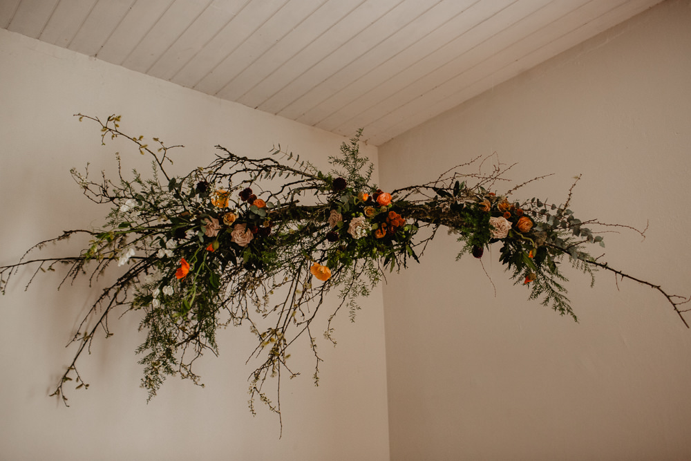 Branch Installation Flowers Wild Natural Orange Rose Autumn Fall Candles Backdrop Floral Elopement Wedding Ideas Oilvejoy Photography
