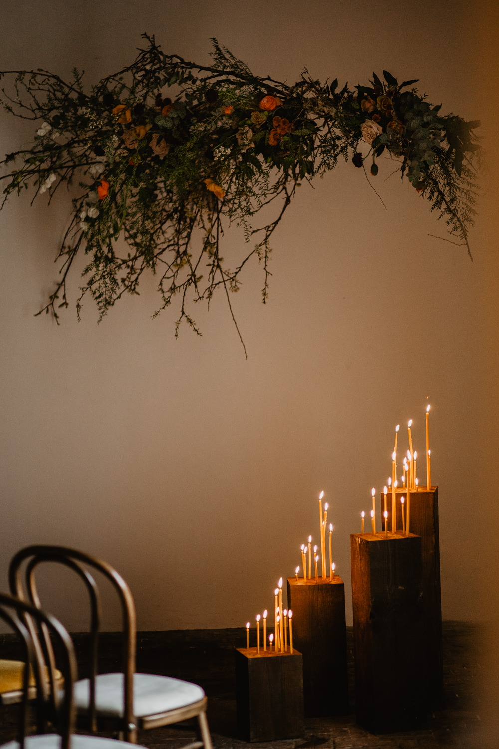 Branch Installation Flowers Wild Natural Orange Rose Autumn Fall Candles Backdrop Floral Elopement Wedding Ideas Oilvejoy Photography
