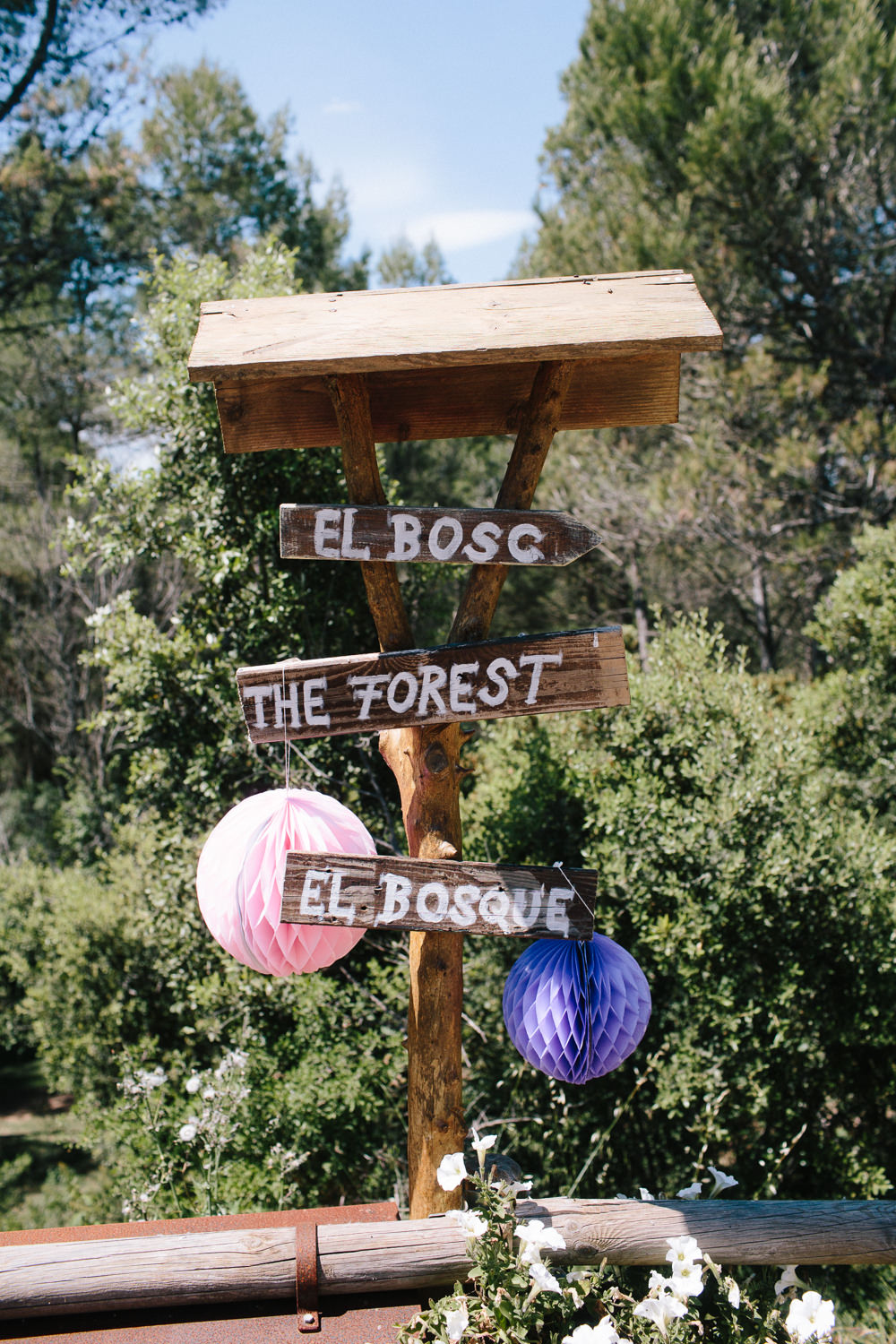 Wooden Sign Post Direction Paper Lantern Forest Spain Destination Wedding Dan Hough Photography