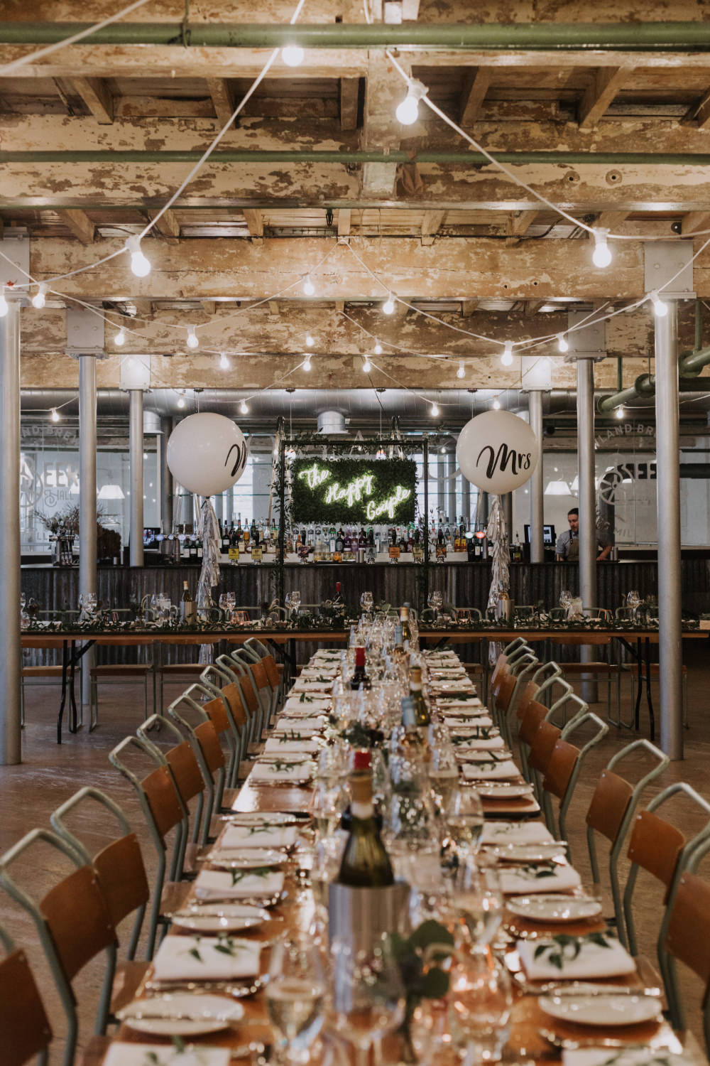 Industrial Decor Reception Long Tables Wooden Festoon Lights Greenery Foliage Chairs Holmes Mill Wedding Siobhan Amy Photography