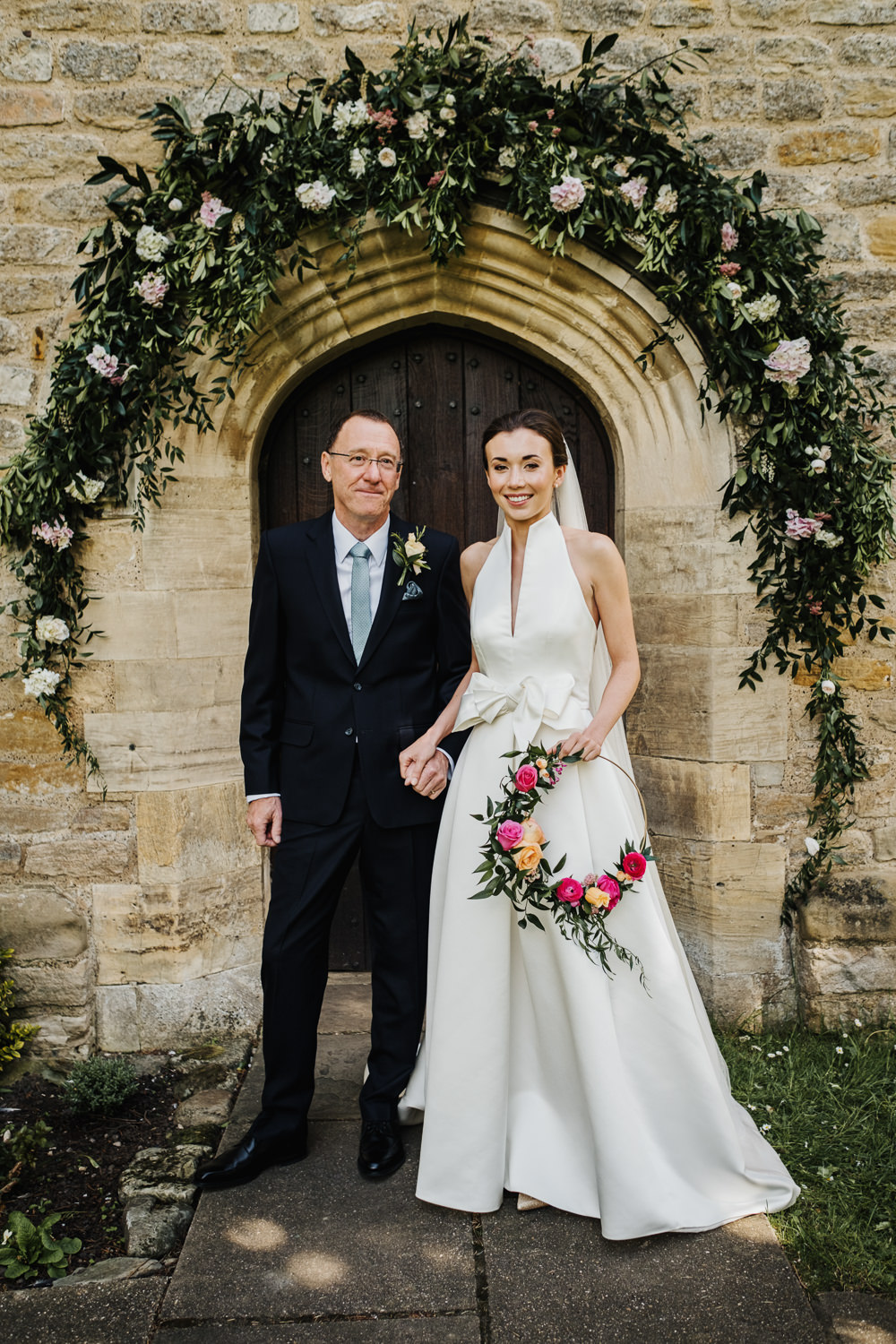 Bride Bridal Halterneck Collar Dress Gown Pockets Bow Jesus Peiro Floral Hoop Veil Greenery Floral Church Arch Middlethorpe Hall Wedding Andy Withey Photography