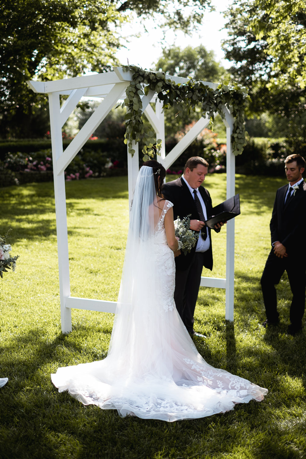Wooden Arch Ceremony Aisle Frame Greenery Foliage Missouri Wedding Nick Mehn Photography
