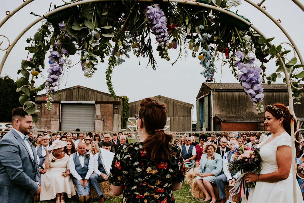 Bride Bridal V Neck Cap Sleeve Tea Length Dress Gown Flower Crown Ceremony Arch Floral Flowers Blue Suit Groom Bert's Barrow Wedding Shutter Go Click Photography