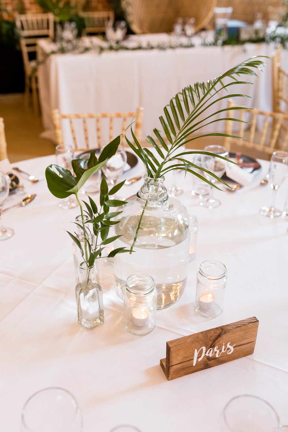 Table Centre Leaf Tropical Glass Bottle Botanical Barn Wedding Heather Jackson Photography