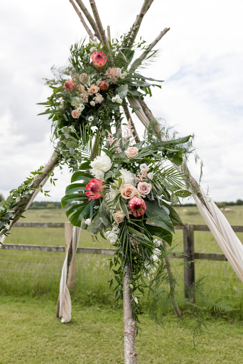 Ceremony Backdrop Naked Tipi Greenery Flower Floral Botanical Barn Wedding Heather Jackson Photography