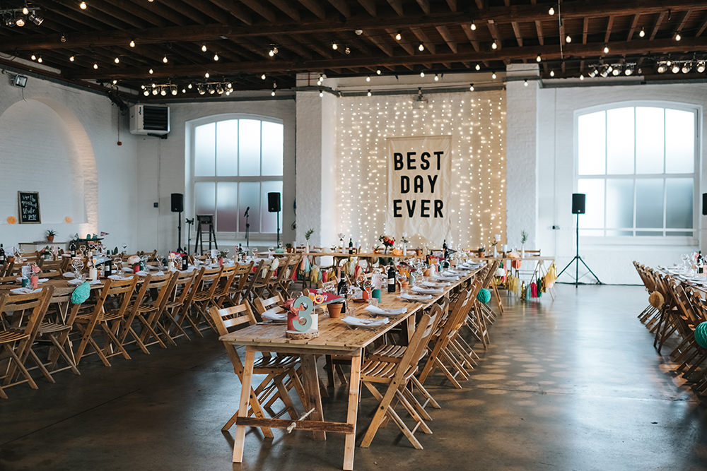 Warehouse Venue Decor Decoration Festoon Lights Sign Banner Backdrop Fairy Light Curtain Trestle Tables Fun London Wedding Miss Gen Photography
