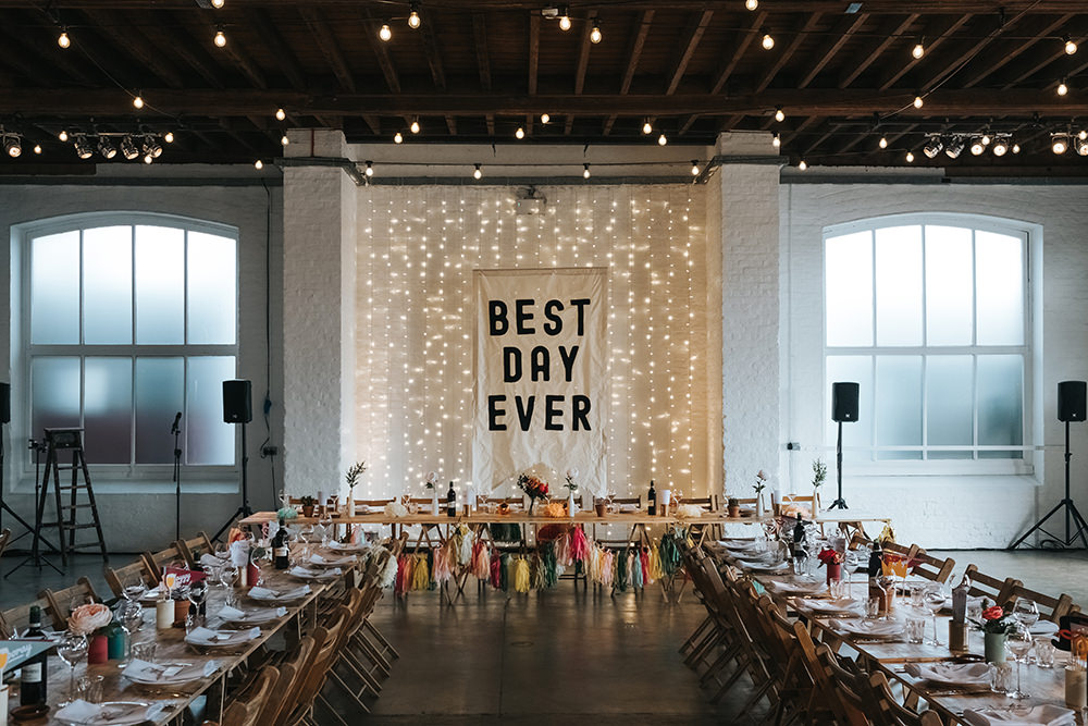Warehouse Venue Decor Decoration Festoon Lights Sign Banner Backdrop Fairy Light Curtain Trestle Tables Fun London Wedding Miss Gen Photography