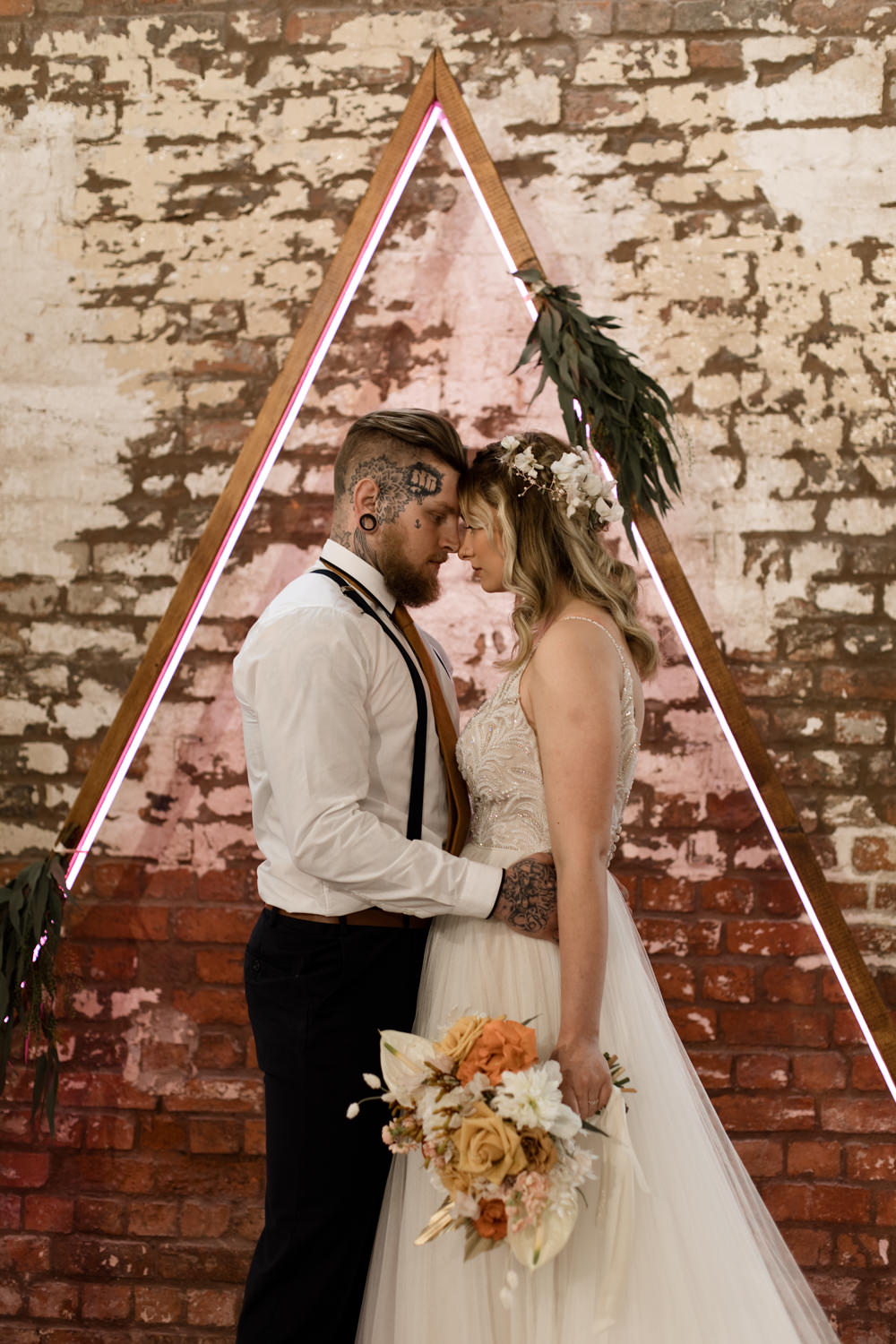 Triangle Backdrop Wooden Frame Neon Lighting Ceremony Greenery Foliage Moroccan Wedding Ideas Emma Louise Photography