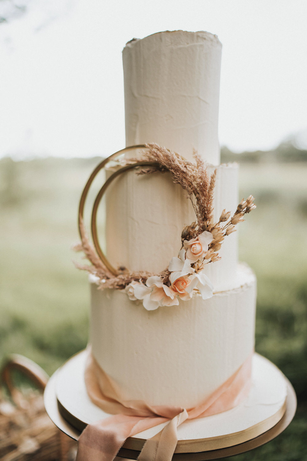Cake Iced Buttercream Hoop Dried Flowers Florals Wheat Grass Grasses Ribbon Naked Tipi Wedding Ideas Holly Rose Stones