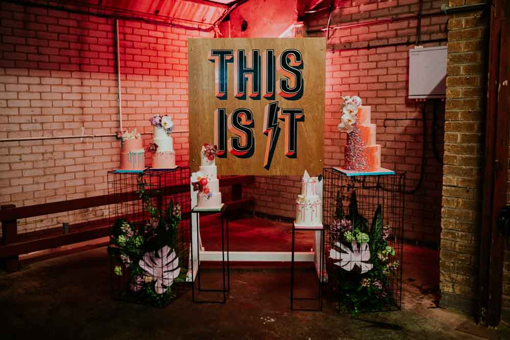 Backdrop Sign Banner Cake Table Cakes Drip Ombre Floral Flowers Alternative Glitter Neon Sign Wedding Ideas State Of Love and Trust Photography