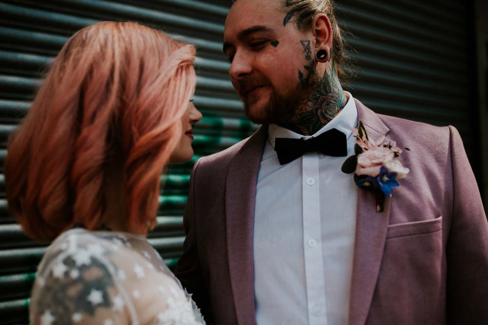 Groom Suit Pink Blazer Jacket Bow Tie Neon Sign Wedding Ideas State Of Love and Trust Photography