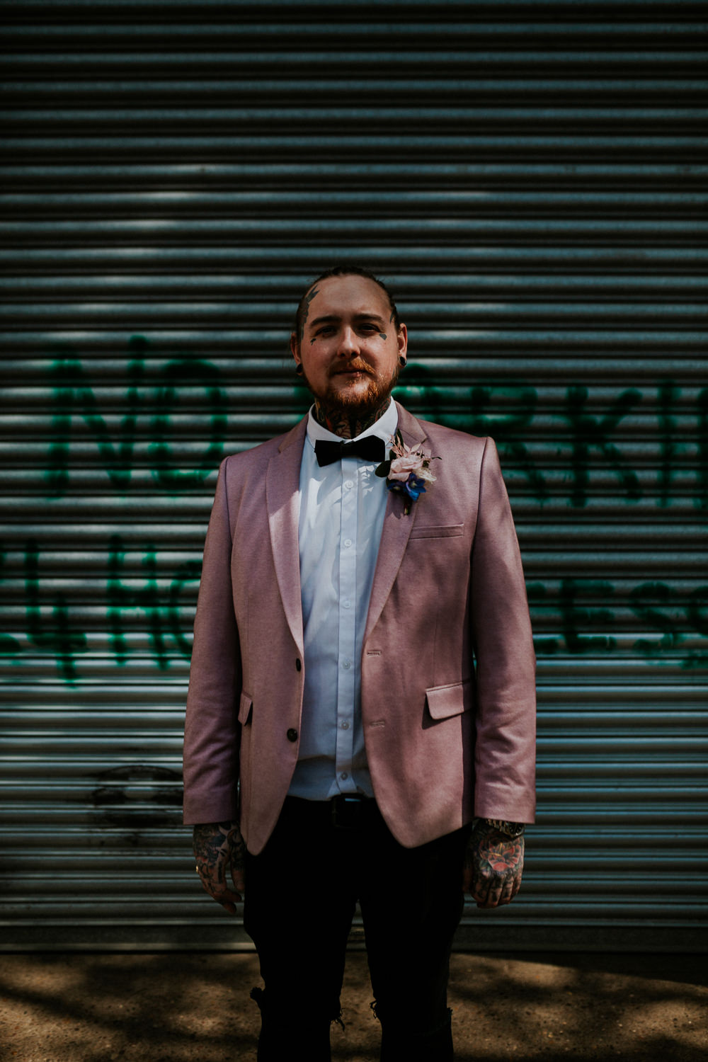 Groom Suit Pink Blazer Jacket Bow Tie Neon Sign Wedding Ideas State Of Love and Trust Photography