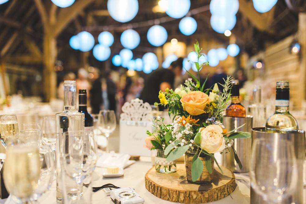 Table Flowers Centrepiece Orange Coral Flowers Log Slice Priory Little Wymondley Wedding Milk Bottle Photography