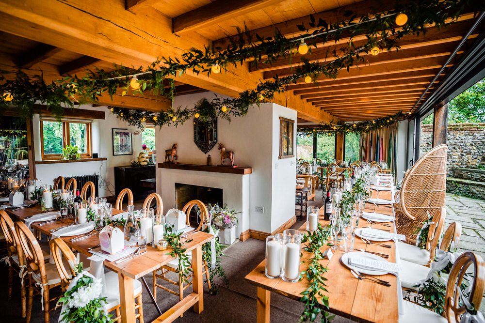 Wooden Tables Greenery Foliafe Runner Swag Centrepiece Candles Secret Garden Wedding James Powell Photography