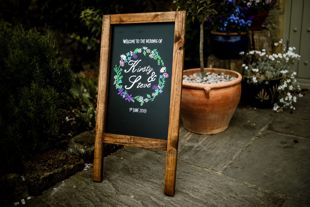 Welcome Sign Chalk Black Board Floral Calligraphy Signs Yorkshire Barn Wedding Hayley Baxter Photography