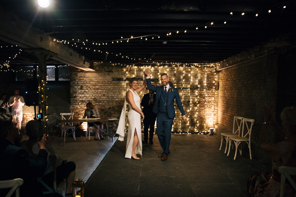 Electrician’s Shop Trinity Buoy Wharf Ceremony Fairy Lights Bridal Jumpsuit Wedding Emily Jarrett Photography